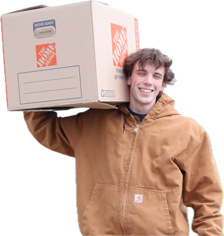 Founder of Monkey Movers carrying a moving box on his shoulder
