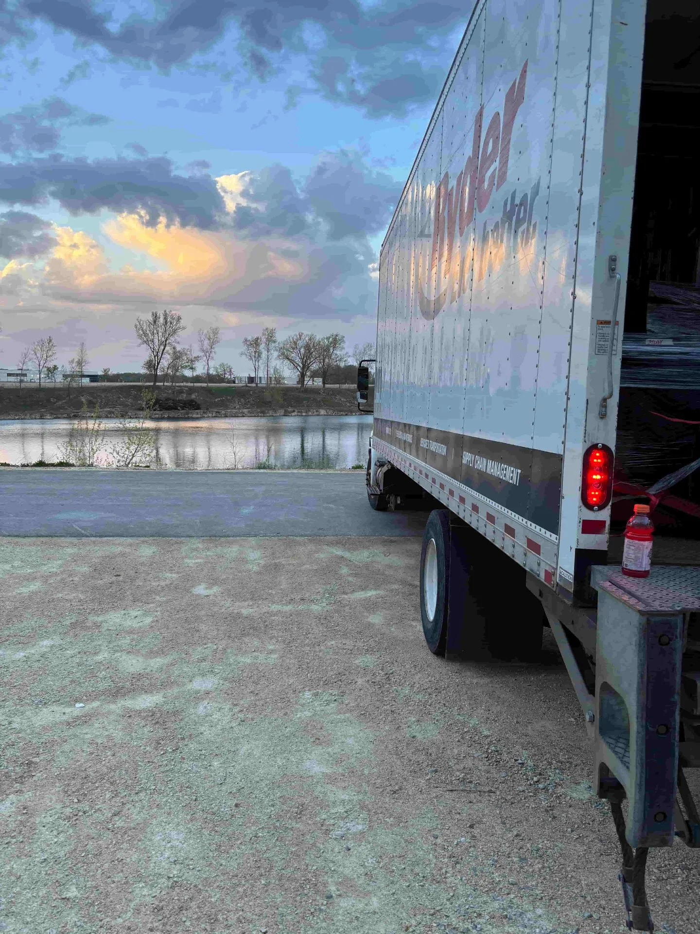 Moving truck parked lakeside at dusk after a long-distance move from Milwaukee